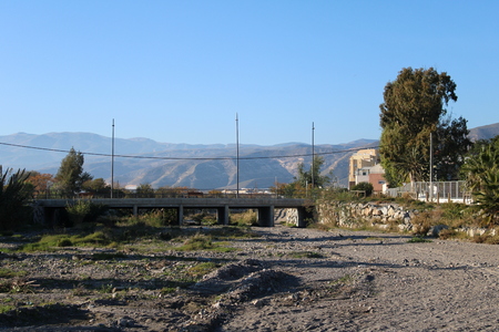 Cement bridge for cars crossing dry riverbedの写真素材