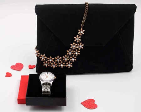 Red box with silver watch and bag wit flower pendantの写真素材