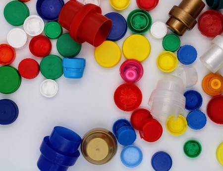 Plastic plugs of various colors and sizes on white backgroundの写真素材