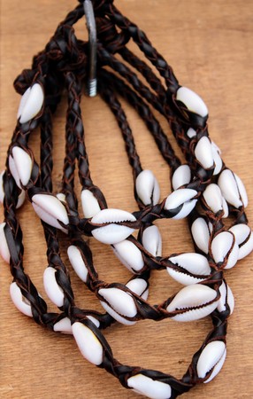 Brown braided leather necklaces and white shellsの写真素材