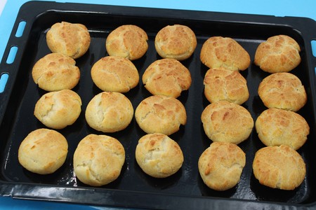 Round and appetizing home made baked profiteroles with a nice tan colorの写真素材