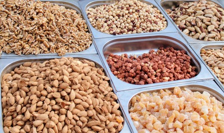 Variety of nuts in containers exposed in the market
