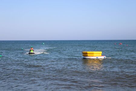 Place of leisure with hydrobicycles and water activities in the Urbanization of Roquetas de Mar of AlmerÃ­a in Spain on july 14, 2019のeditorial素材