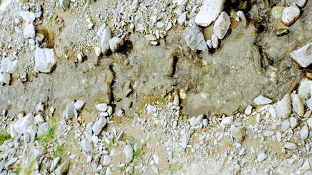 Image of backgrounds for graphic resource with water sliding between stonesの写真素材