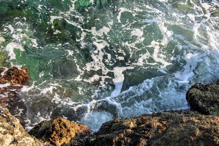 Image for backgrounds of small waves breaking on the rocksの写真素材