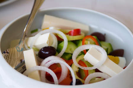 This is national Greek recipe. It contains black olives, brinsen cheese, vegetables and olive oil.の写真素材