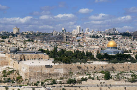This is panorama of Jerusalem city. Photo contains ancient building, domes and modern architecture...