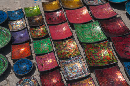 Traditional Arabic decorative mosaic plates are laid out on  the square  Such view is common for...