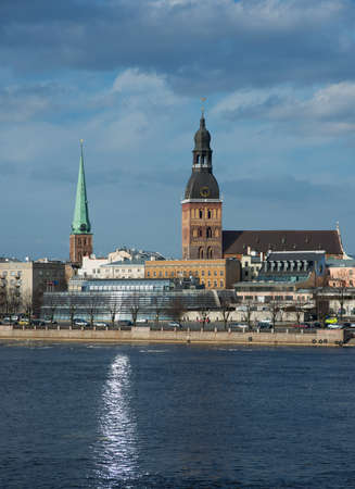 This is the view of Riga (latvia) in day. Daugava river is in the foreground, modern and historic...