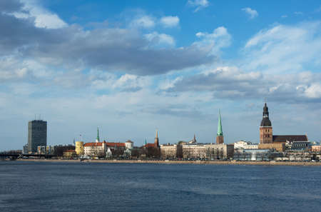 This is the view of Riga (latvia) in day. Daugava river is in the foreground, modern and historic...