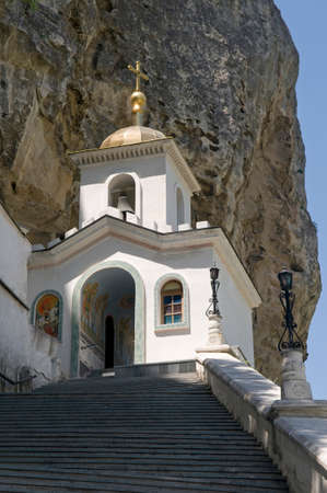This is  Uspensky monastery in Bakhchisaray, Crimea. White church is built into the rock.の写真素材