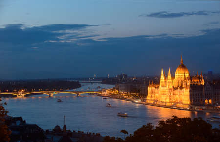 This is a night view of Budapest (Hungary). Illuminated building of the parliament is the point of culmination in this architectural composition. の写真素材
