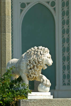 The marble lion sculpture is situated on the Southern veranda of Vorontsov palace (Alupka, Crimea). The animal sculpture is sunlit.のeditorial素材