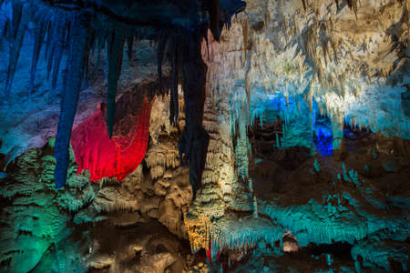 Inside of Prometeus or Cumistavy cave - Georgia. Illuminated multicolored stalactites and stalagmites are incomparable.の写真素材