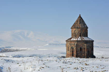 Church of St Gregory of the Abughamrents ancient town Ani, Turkey against winter landscape.の写真素材