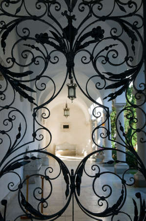Sunlit Italic patio of Livadia Palace Crimea through beautiful old hammer-work screen.