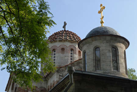 Domes of the eldest Kerch church Crimea against sky background. Church of Saint John the Baptist was...