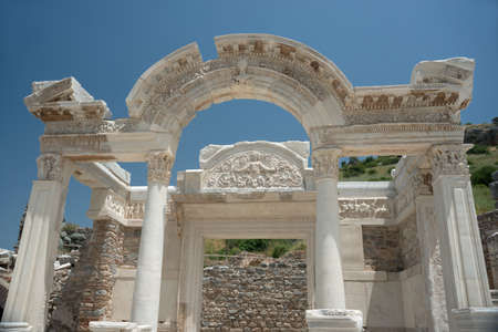 Highly decorated marble white temple against blue sky background. Ruins of ancient Greek and Roman city Ephesus now - Turkey.の写真素材