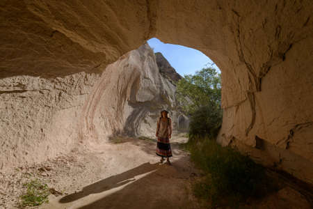 Woman in natural  rock tube. Place - Cappadocia (Turkey).の写真素材