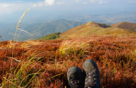 Hiking boots and mountains landscape. Mountain travel illustration.の写真素材
