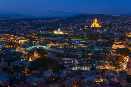 Night scene in Tbilisi (Georgia). All main landmarks on one shot: illuminated  Sameba cathedral,...