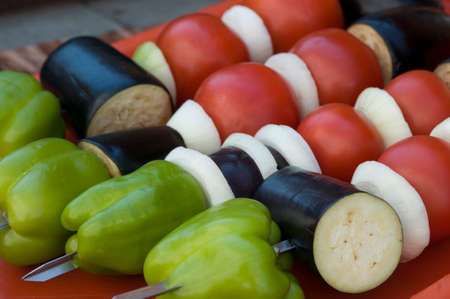 Vegetables (tomato, eggplant, onion and paprika) are spat for grill cooking.の写真素材