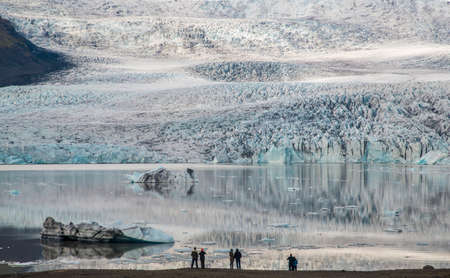 Tourists are looking for Ice Lagoon Fjallsarlon. Glacier of this lagoon is just a short distance away view point.の写真素材