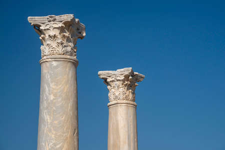Two antique columns against blue sky background. Ancient Salamis city (North Cyprus).の写真素材