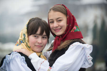 Two girls dressed in traditional Romanian clothes (Maramuresh region).のeditorial素材