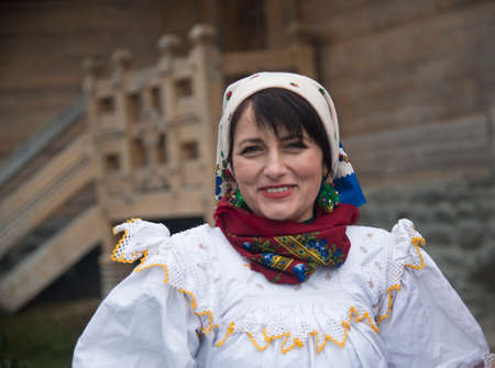 Young woman dressed in traditional Romanian (Maramuresh region) clothes. Portrait. Christmas Celebration.のeditorial素材