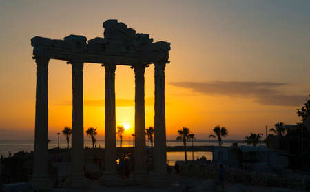 Apollo Temple silhouette (Side, Turkey). Sunset over sea in the background.の写真素材