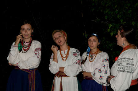 Kiev, Kievskaya Oblast/Ukraine - 07.06.2011. Beautiful girls in Ukrainian costumes sing songs. Ivan Kupala holiday night.のeditorial素材