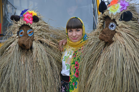 Chernivtsi, Chernivtsi Oblast, Ukraine - 15.01.2013 : Malanka parade in Chernivtsi. Characters in straw suit.のeditorial素材