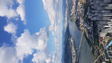 This is the scenery of Seoul, the capital of Korea. The Han River, the bridge across it, and the...