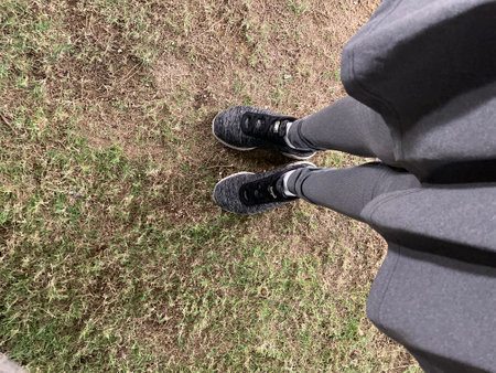 Woman with shoes and skirt sporty in the parkの写真素材