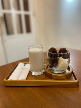Milk and Coffee cube on wooden tableの写真素材