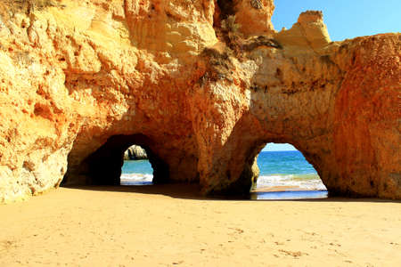 Limestone arcs - Praia Dos Tres Irmaos near Portimaoの写真素材