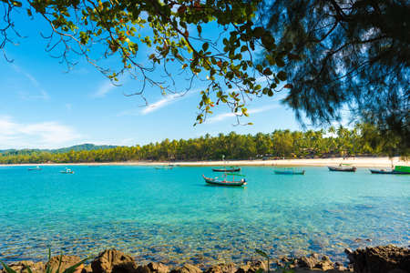 NGAPALI, MYANMAR - DECEMBER 5, 2016: Fishing boats on the beach. Copy space. Space for textのeditorial素材