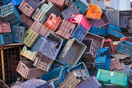 PUTTAPARTHI, ANDHRA PRADESH - INDIA - NOVEMBER 09, 2016: Many colored plastic boxes for collecting fruits and vegetablesのeditorial素材