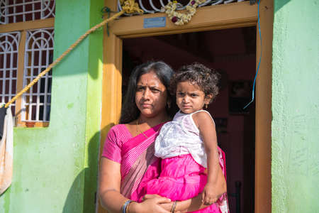 PUTTAPARTHI, ANDHRA PRADESH - INDIA - NOVEMBER 09, 2016:Indian woman with baby at the street