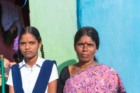 PUTTAPARTHI, ANDHRA PRADESH - INDIA - NOVEMBER 09, 2016: Portrait of an Indian woman and a girl, outdoorsのeditorial素材