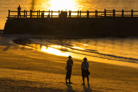 NGAPALI, MYANMAR - DECEMBER 5, 2016: People on sunset background. Copy space. Space for textのeditorial素材