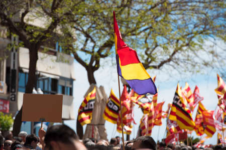 Tarragona, Spain - 01, 05, 2017: People with flags at the street of Tarragona at the 1st of may, international celebrationのeditorial素材