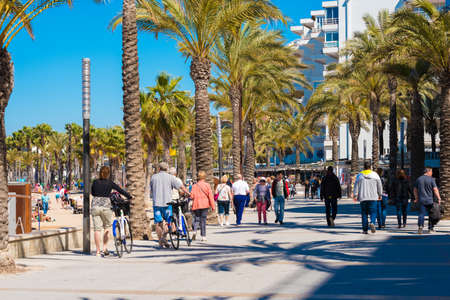 SALOU, TARRAGONA, SPAIN - APRIL 24, 2017: Embankment near the beach. People and cyclists are walking aroundのeditorial素材