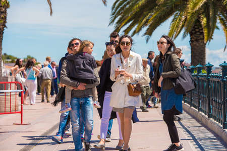 TARRAGONA, SPAIN  MAY 1, 2017: Cheerful tourists on the waterfrontのeditorial素材
