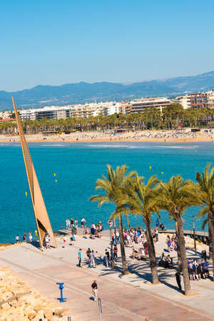 SALOU, TARRAGONA, SPAIN - APRIL 24, 2017: Monument on the main promenade of the Costa Dorada. Blue sky. Copy space. Verticalのeditorial素材