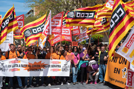 Tarragona, Spain - 01, 05, 2017: People with flags at the street of Tarragona at the 1st of may, international celebrationのeditorial素材