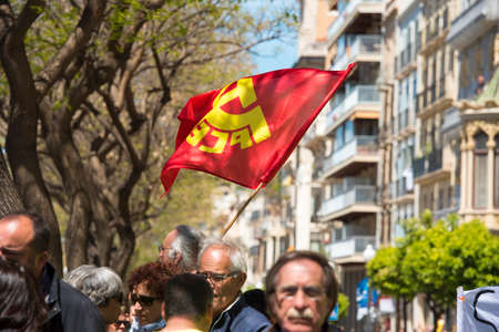 Tarragona, Spain - 01, 05, 2017: People with flags at the street of Tarragona at the 1st of may, international celebrationのeditorial素材