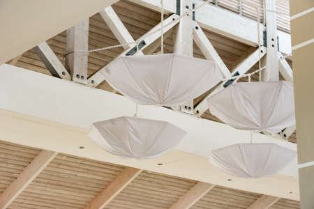 White umbrellas under the ceiling. Island of Cayo Largo, Cuba. Close-up