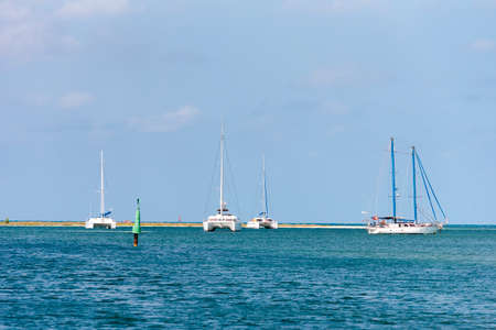 White yachts near the shore of the island of Cayo Largo, Cuba. Copy space for text